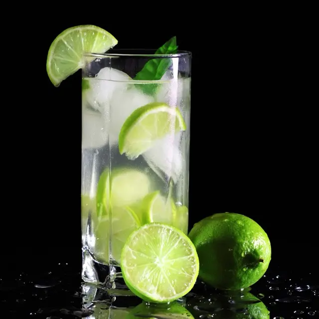 Caipirinha with muddled lime over crushed ice