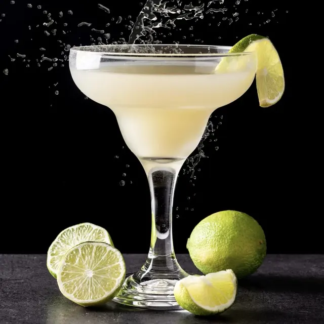 Daiquiri in a coupe glass with a lime wheel