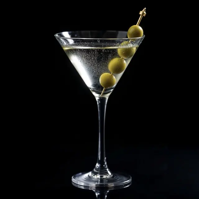 Dry Martini in a chilled glass with green olives
