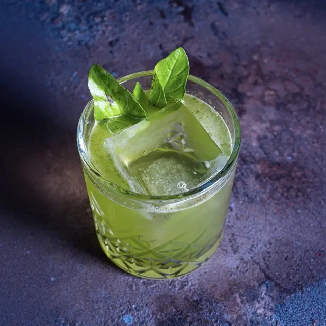 Gin Basil Smash, bright green, over ice