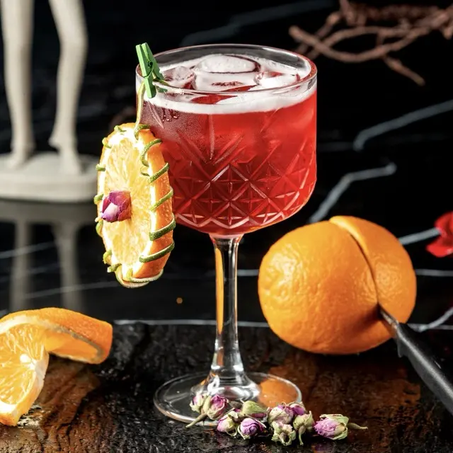 Manhattan in a cocktail glass with a cherry
