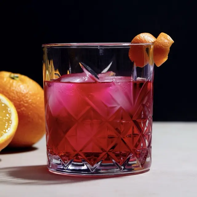 Negroni in a rocks glass with an orange slice
