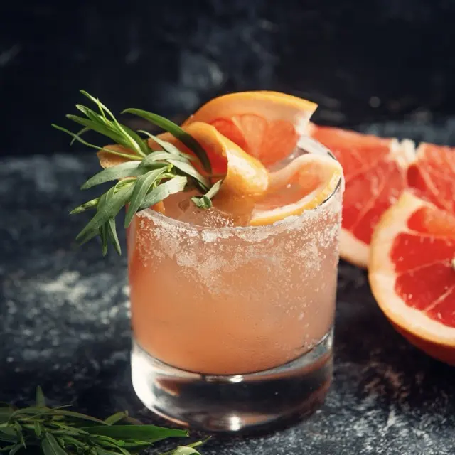 Paloma with pink grapefruit soda and a grapefruit slice